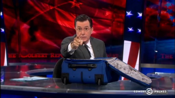 Stephen Colbert with suitcase